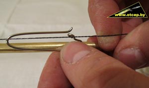 Thread the line through the back loop of the lure retriever